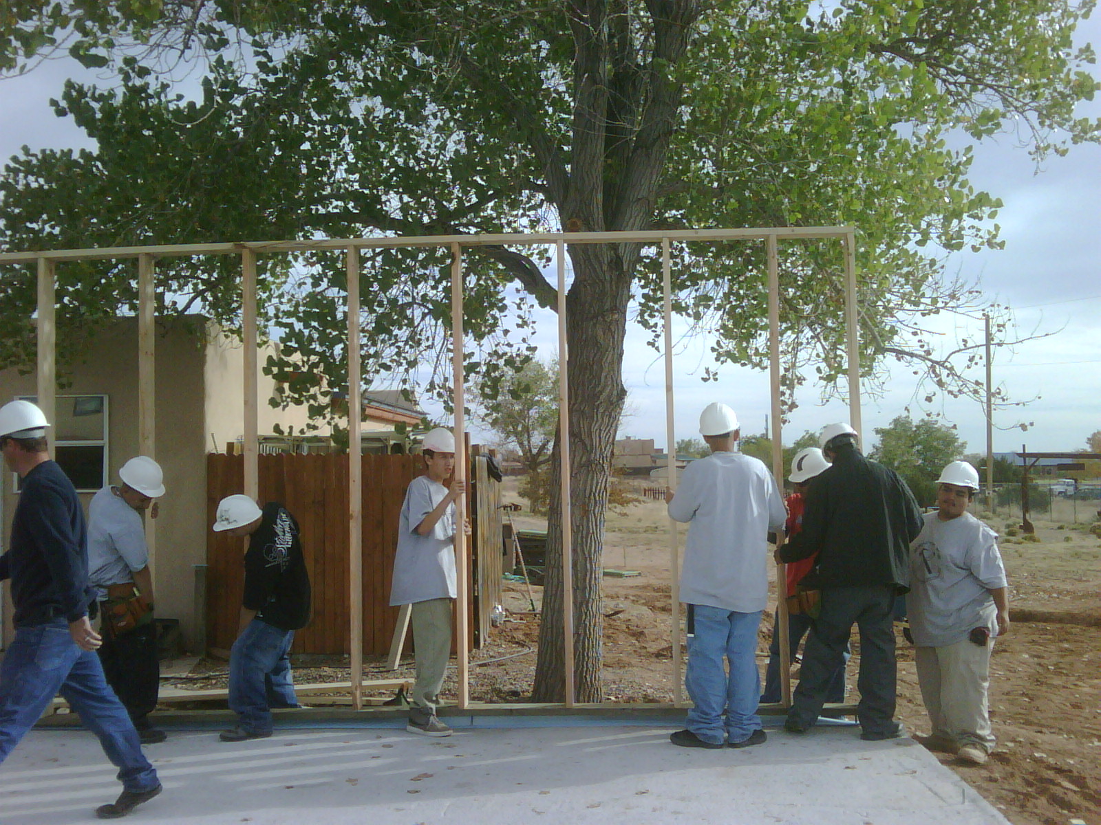 YouthBuild crew works on framing house they're building with Habitat for Humanity.