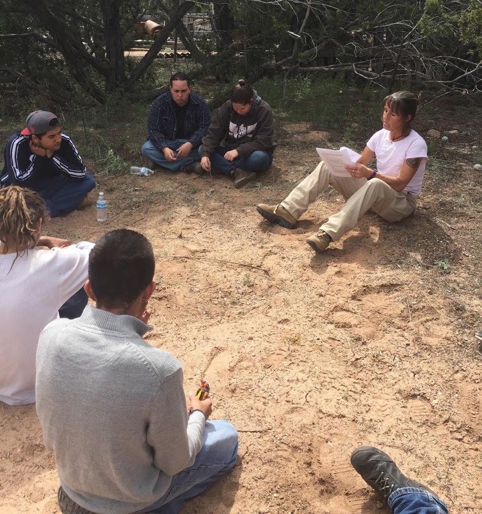 The !YouthWorks¡ Conservation Corps attends class in an outdoor setting.